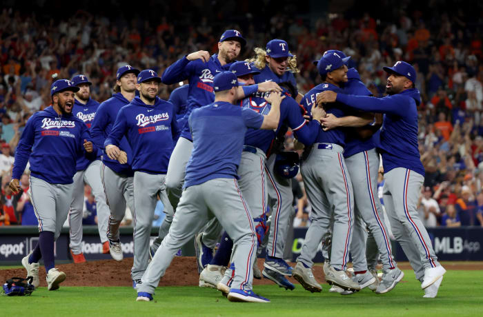 Texas Rangers players celebrate after winning Game 7 in the ALCS over the Houston Astros 11-4 Monday night at Minute Maid Park.
